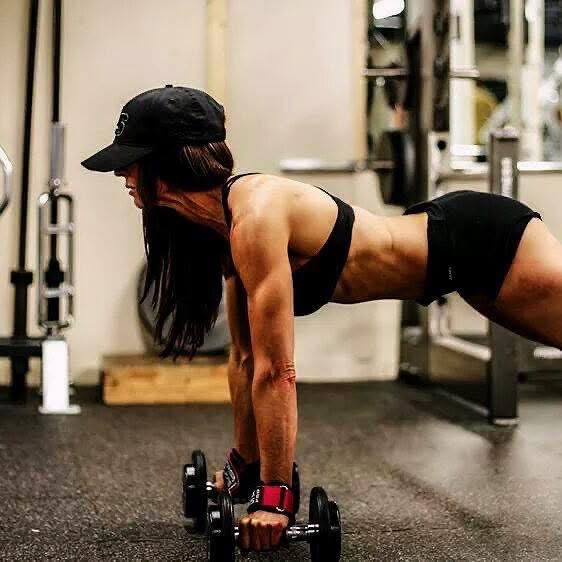 Personal training session — plank rows with dumbbells