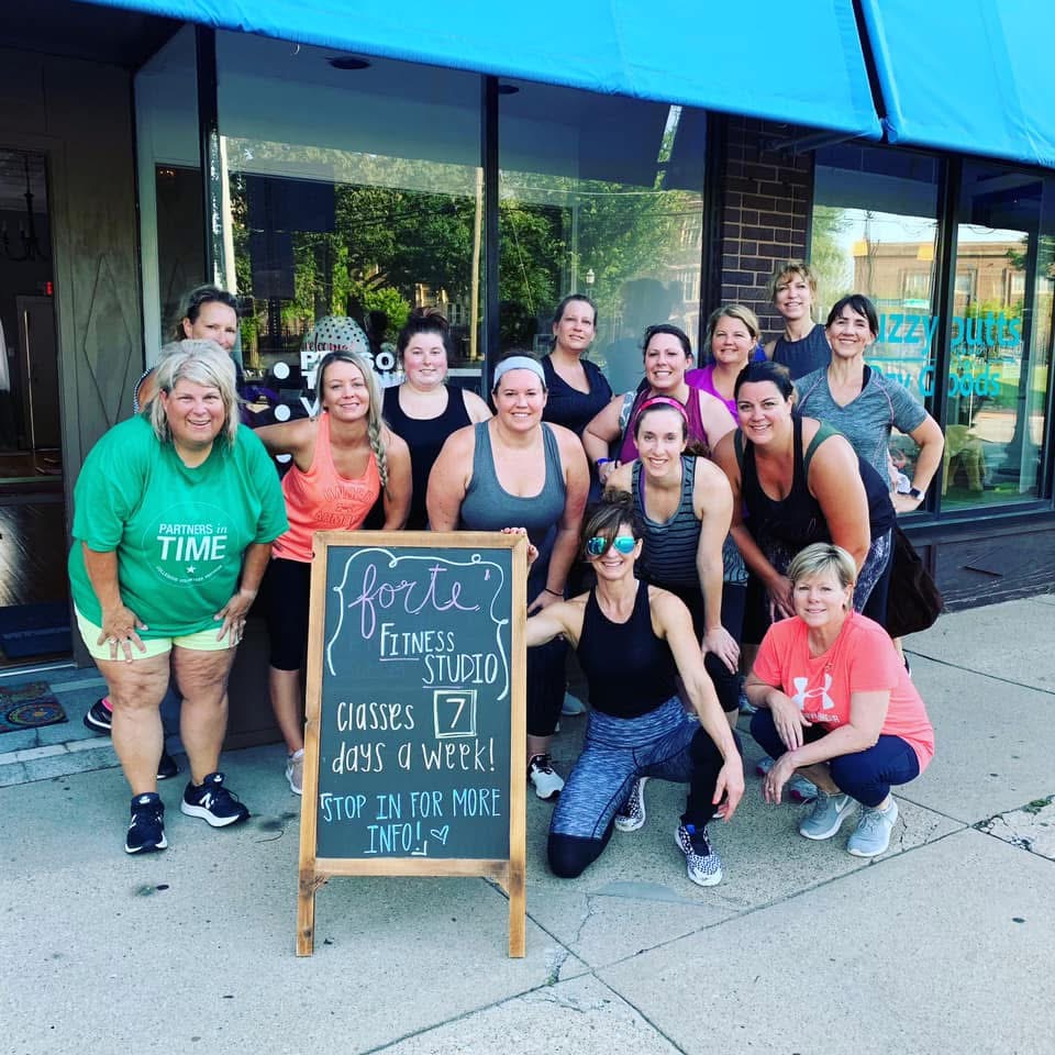 Group with chalkboard sign