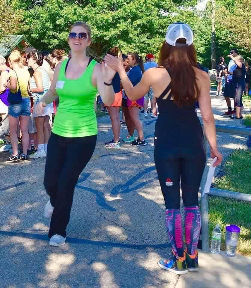 High-five at outdoor fitness event