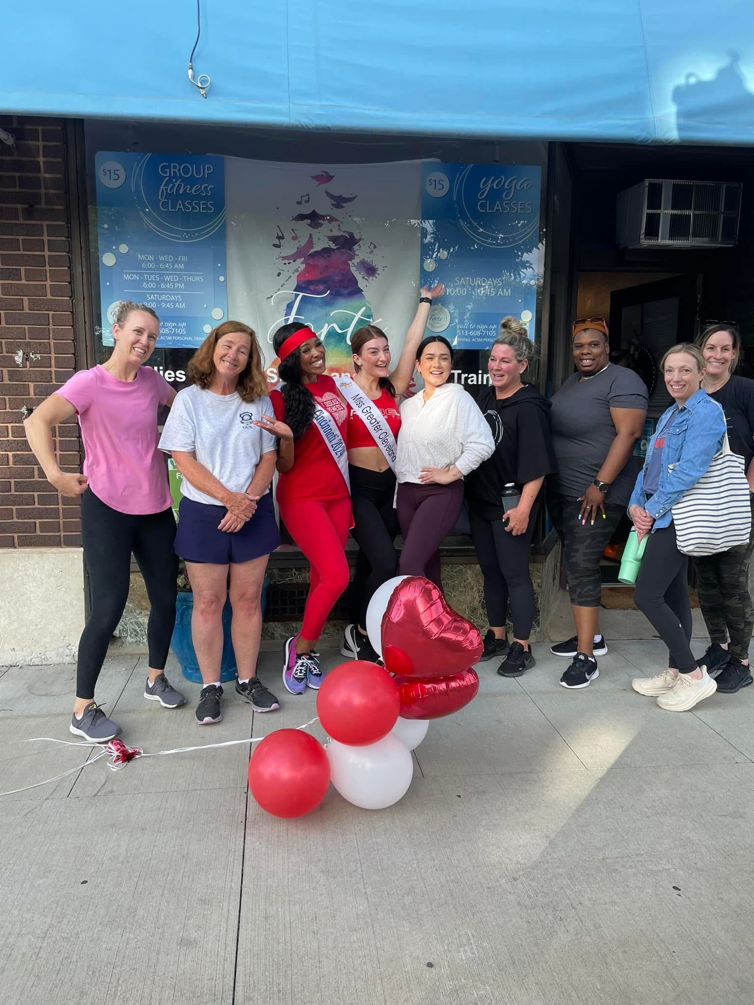 Celebration with balloons at storefront